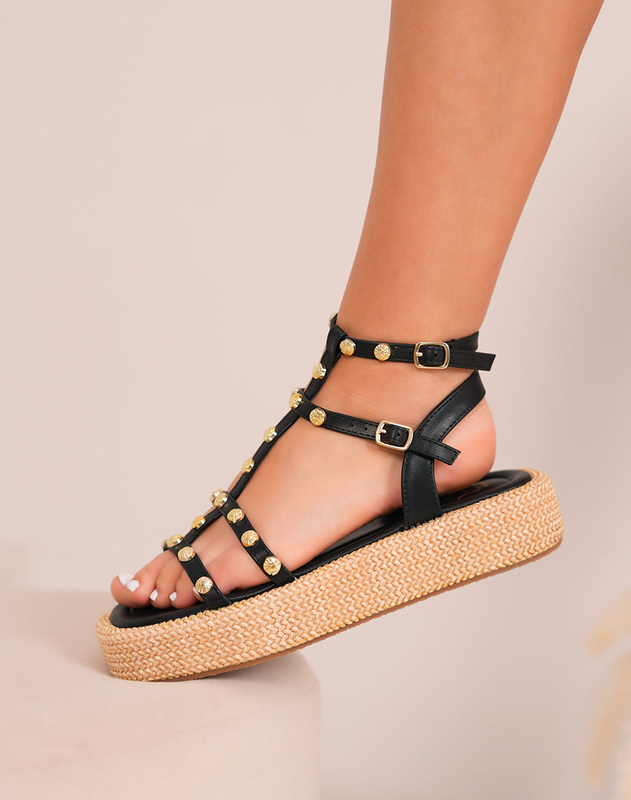 Black women with multiple strips with golden nails and embroidered compensated heel