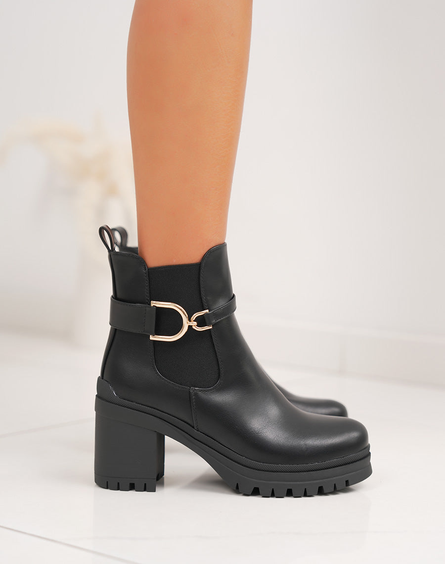 Bottines noires chelsea à talon moyen et boucle dorée