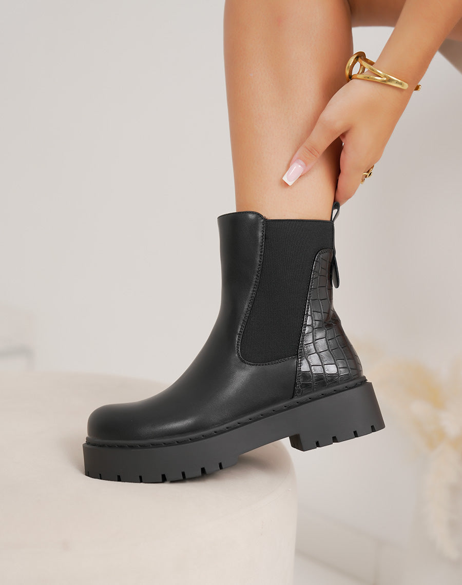 Bottines chelsea noires à effet croco et semelle plateforme