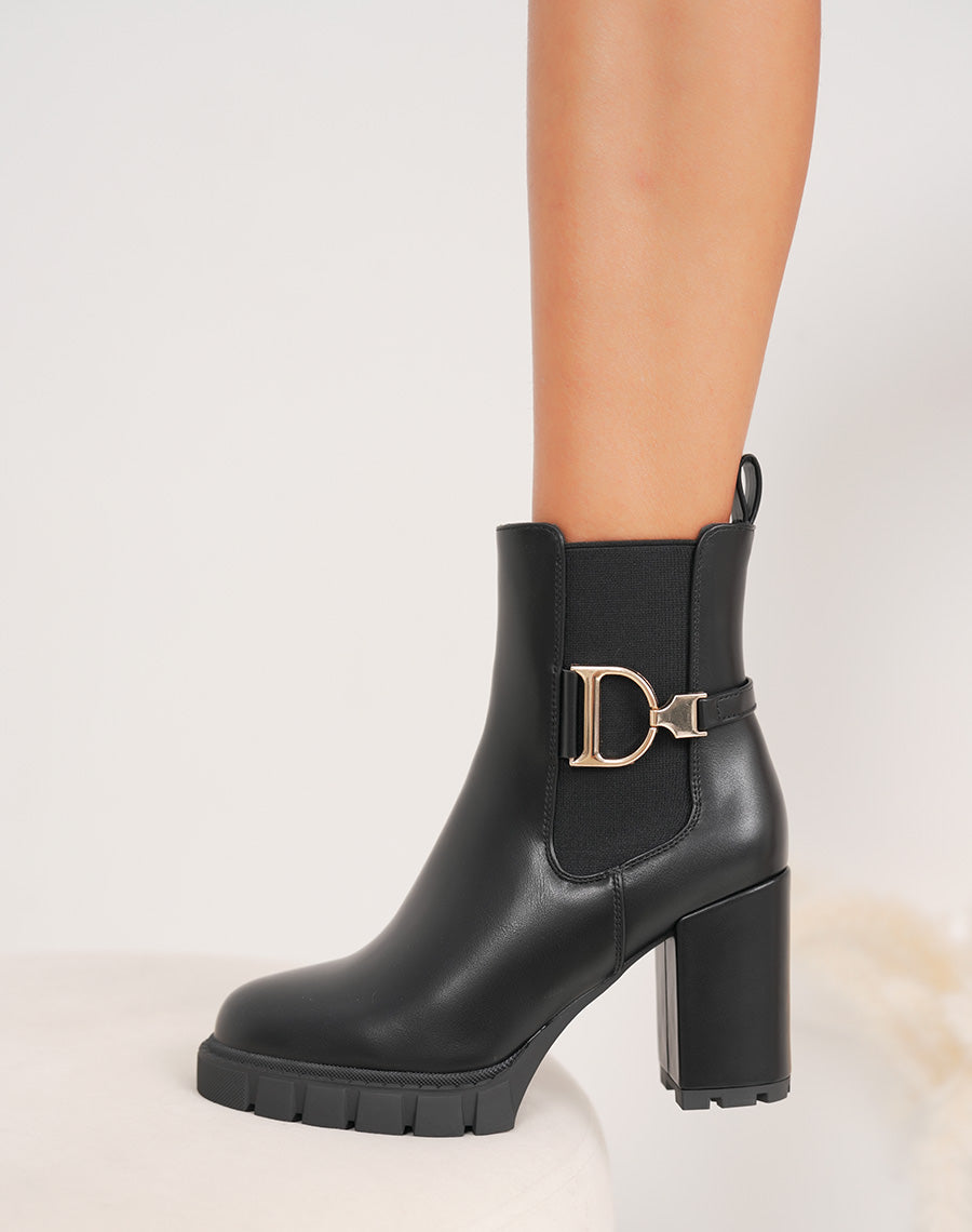 Bottines femme noires style Chelsea à talons hauts avec détail doré et semelle crantée