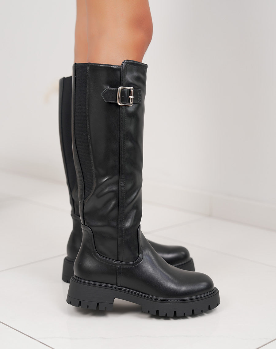 Bottes noires à semelle crantée et boucle argentée