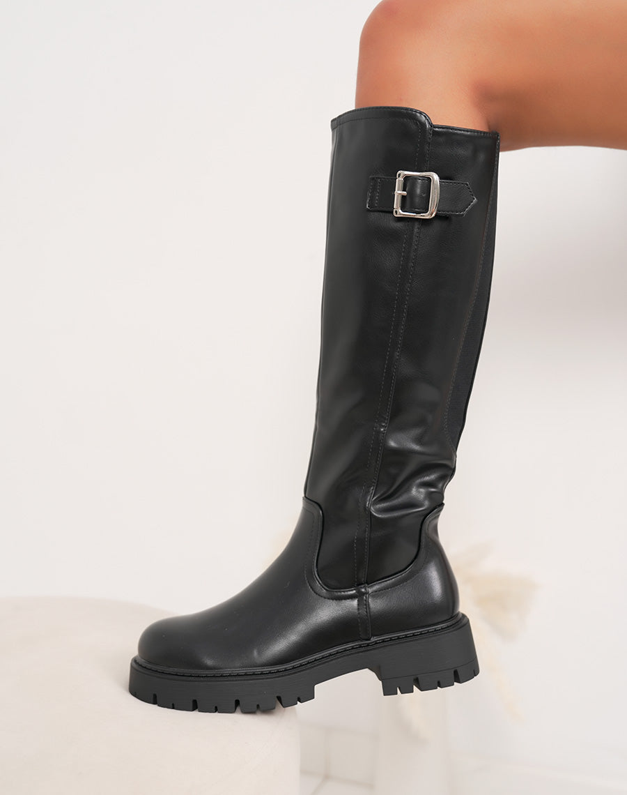 Bottes noires à semelle crantée et boucle argentée