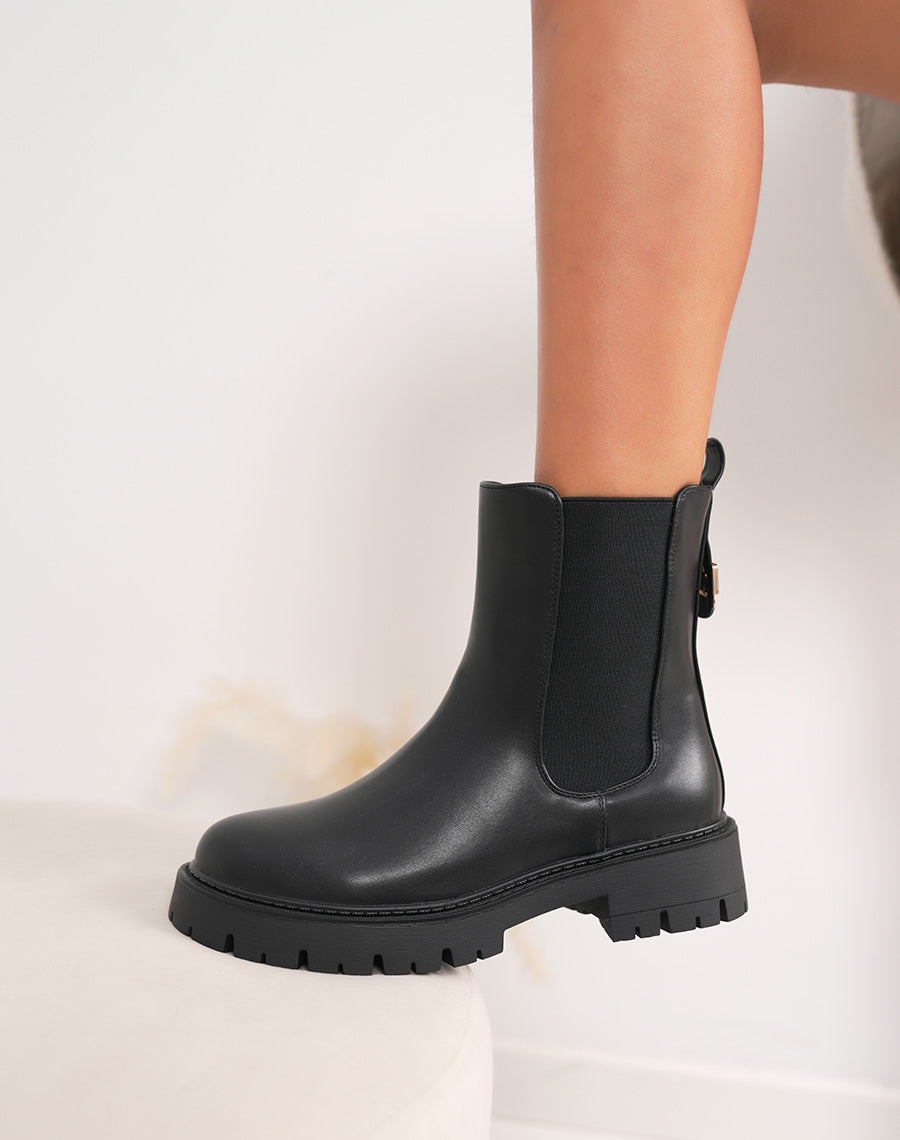 Bottines femme noires élégantes style chelsea avec boucle dorée et semelle crantée