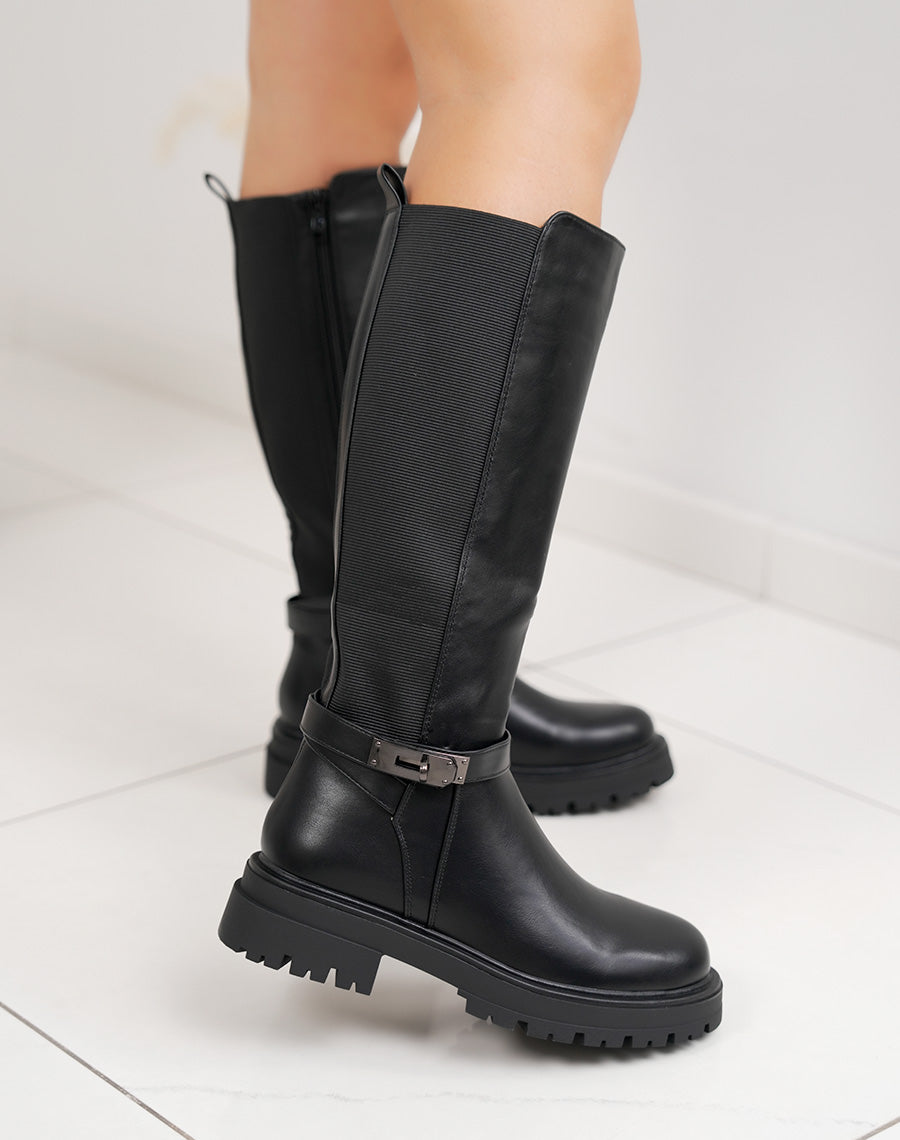 Bottes femme noires fourrées à semelle crantée, élastiquées avec sangle boucle cadenas