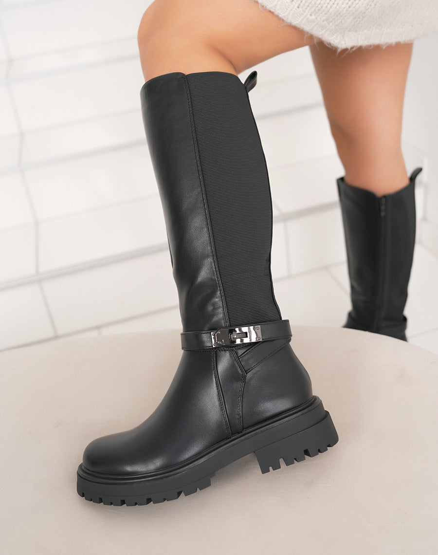 Bottes femme noires fourrées à semelle crantée, élastiquées avec sangle boucle cadenas