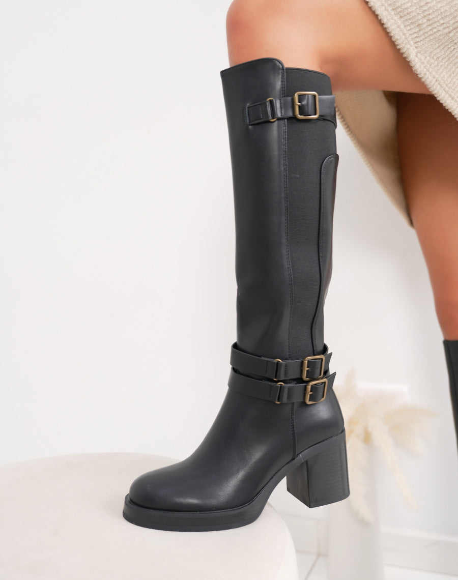 Bottes femme noires fourrées à talon épais, avec boucles dorées et élastique