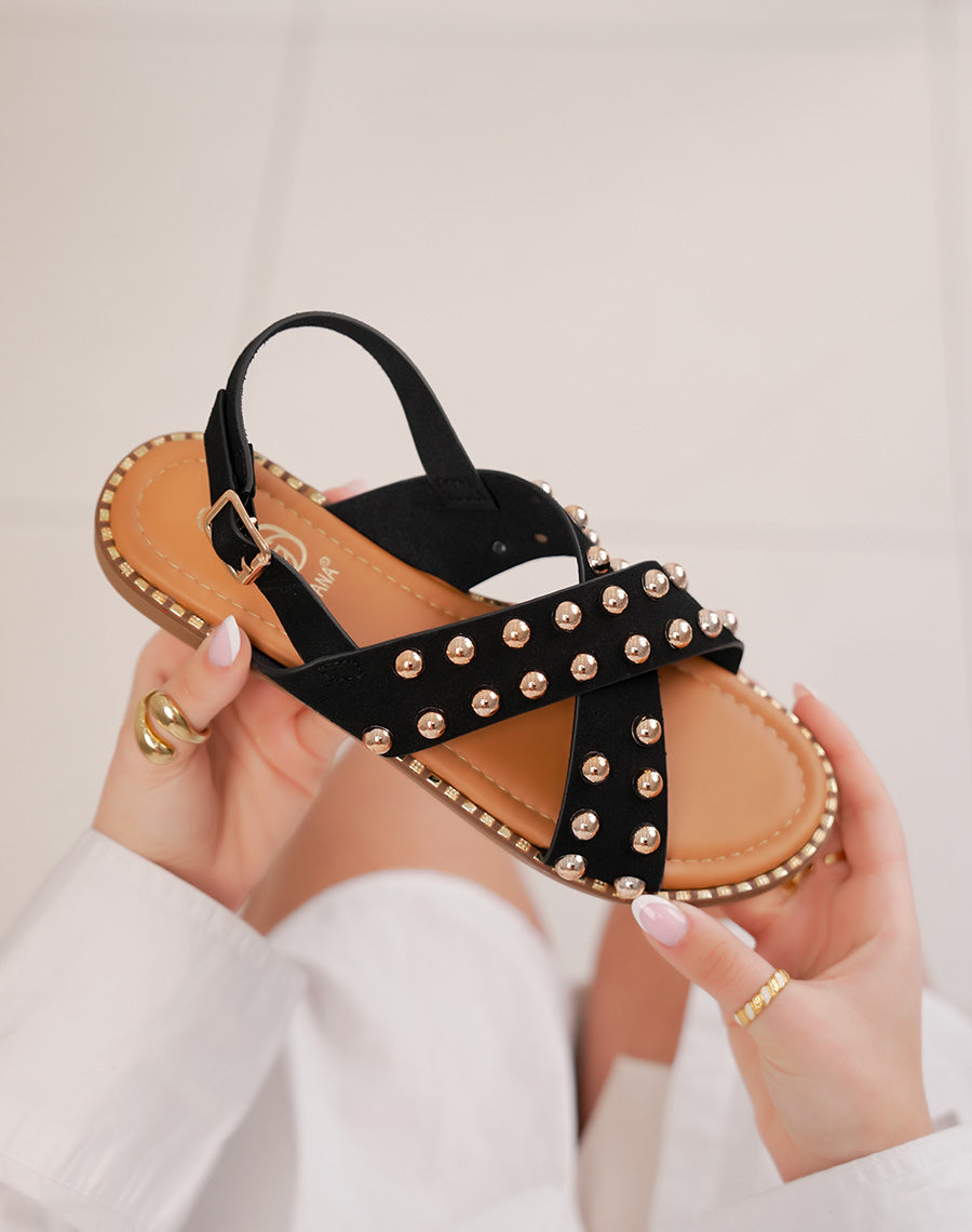 Sandales femme noires plates à brides croisées en suédine et clous dorés