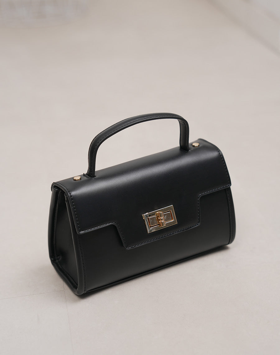Sac noir structuré avec fermoir doré – Élégance intemporelle