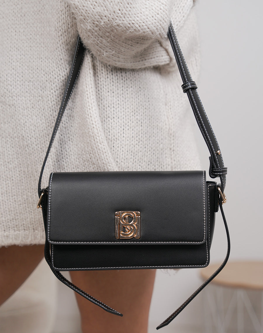 Sac noir à détail doré avec fermeture aimantée