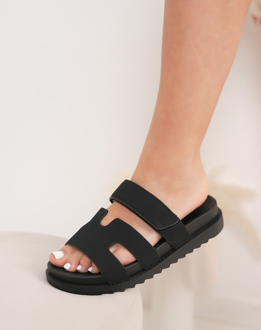 Mules femme noires tendance avec bride en H et scratch réglable