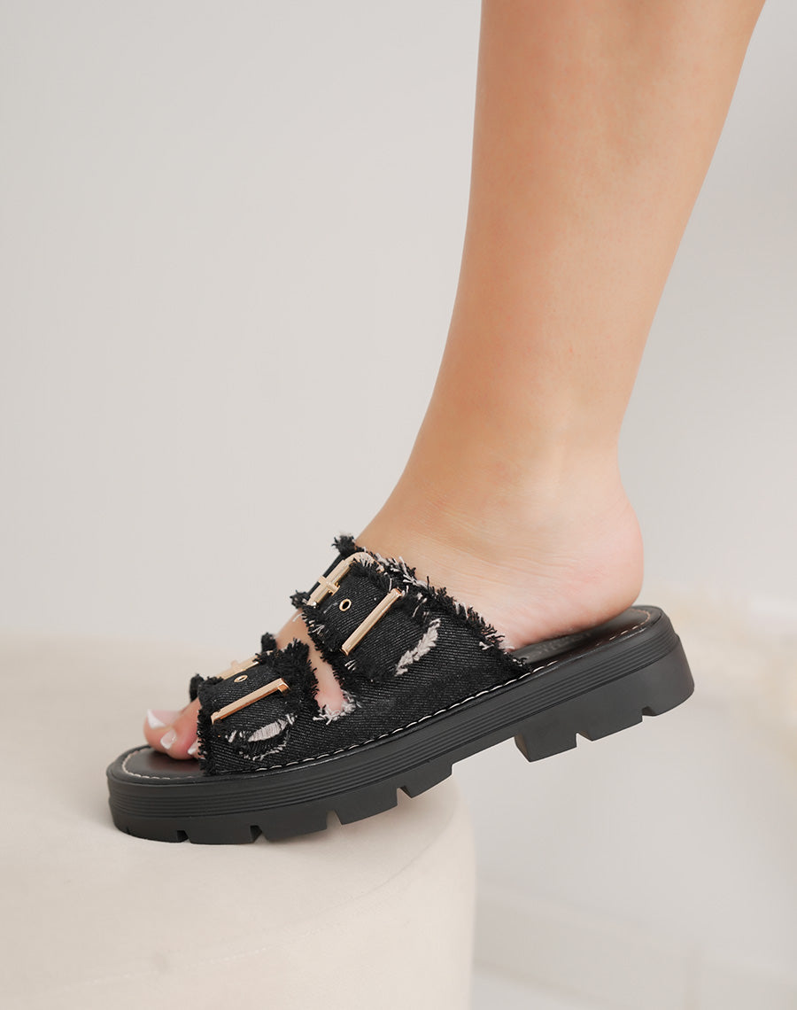 Mules femme noires tendance avec brides effet déchiré et boucles dorées