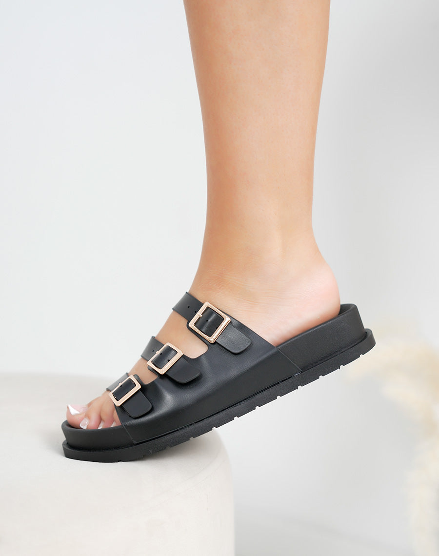 Mules femme noires tendance à brides fines et boucles dorées confortables