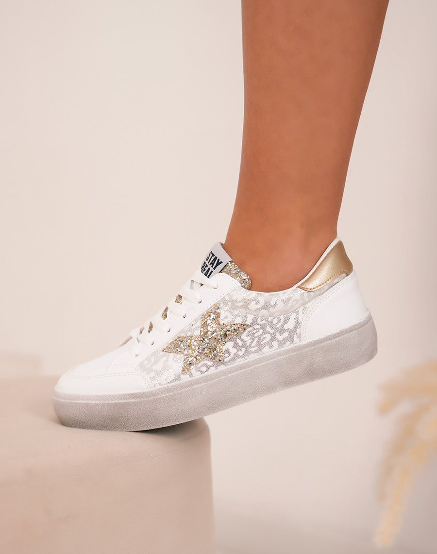 Elegant white women's sneakers with glitter stars and golden details