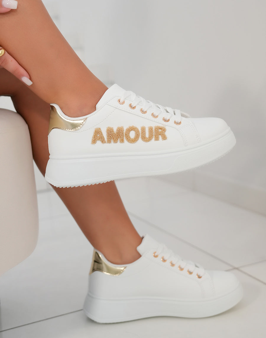 Basket femme blanche avec semelle épaisse et détails dorés