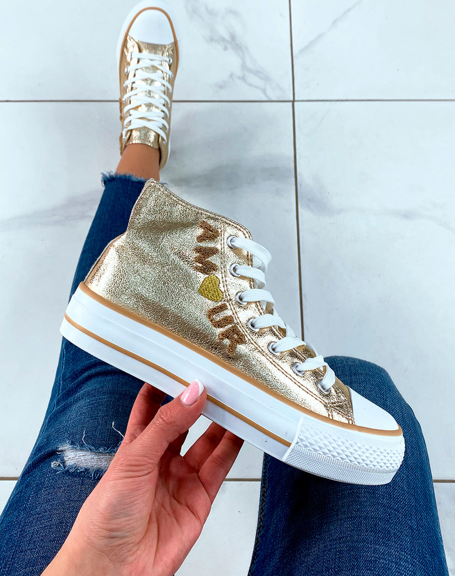 Baskets montantes dorées à lacets