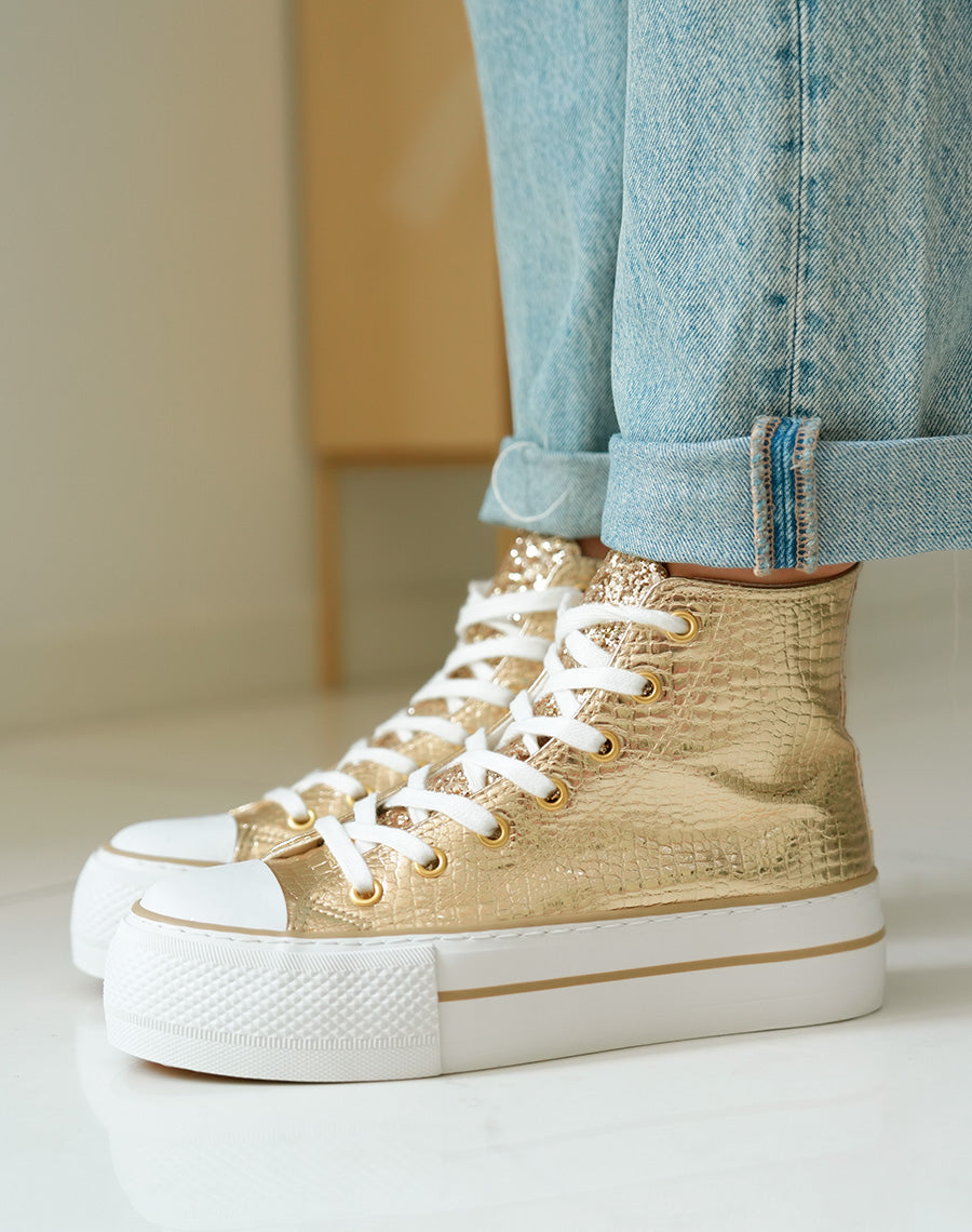 Baskets montantes dorées à semelle épaisse