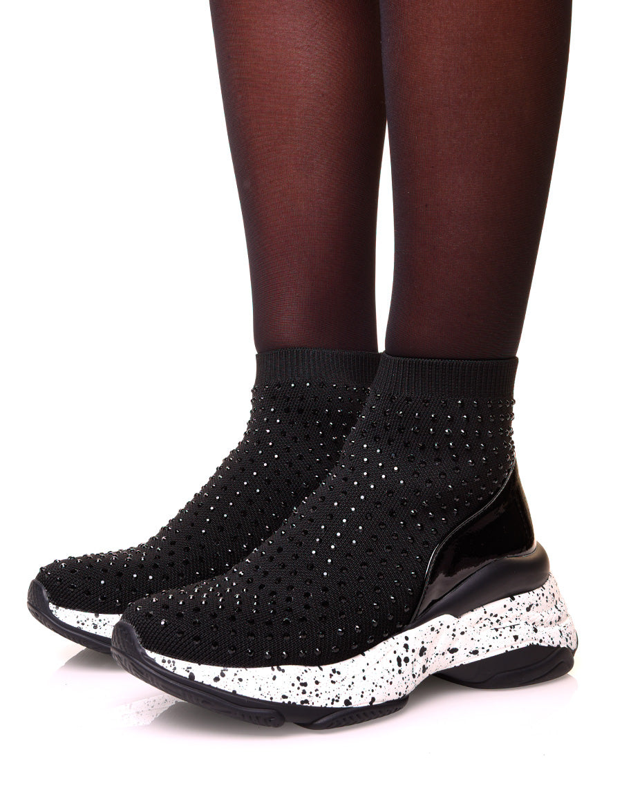 Baskets noires en forme de chaussette à semelles tachetées