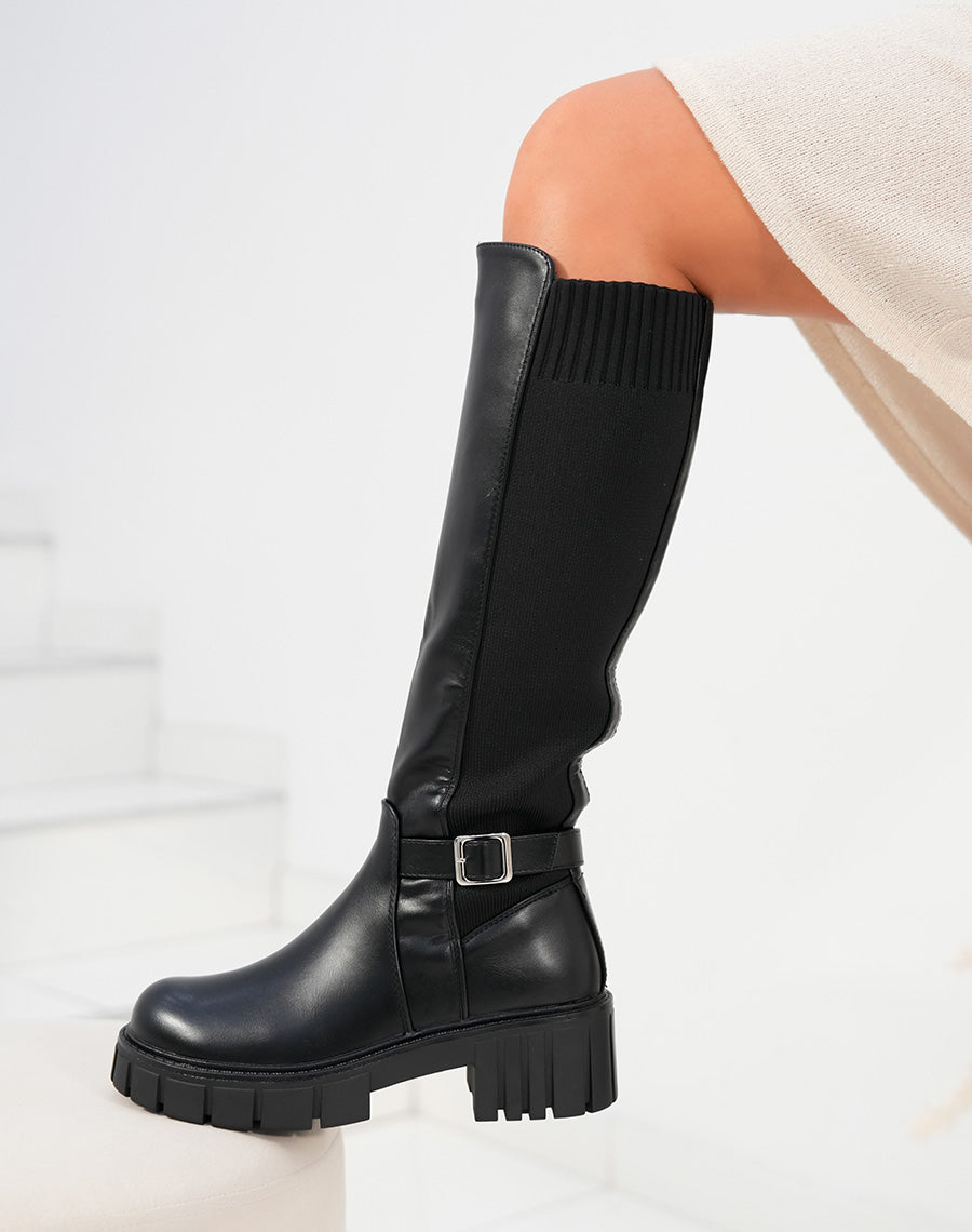Bottes femme noires effet chaussette avec semelle crantée et sangle décorative
