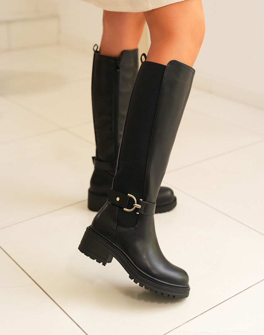 Bottes femme noires hautes avec lanière dorée et semelle crantée