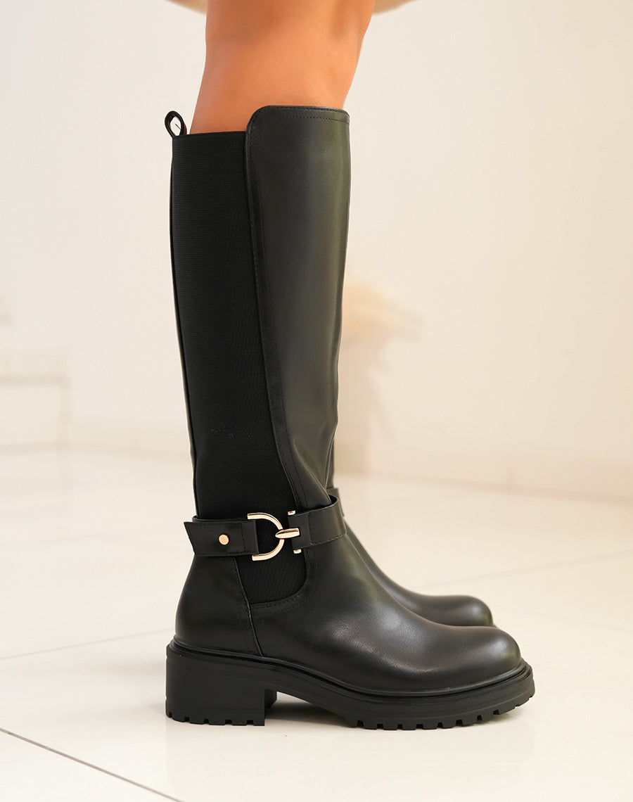 Bottes femme noires hautes avec lanière dorée et semelle crantée