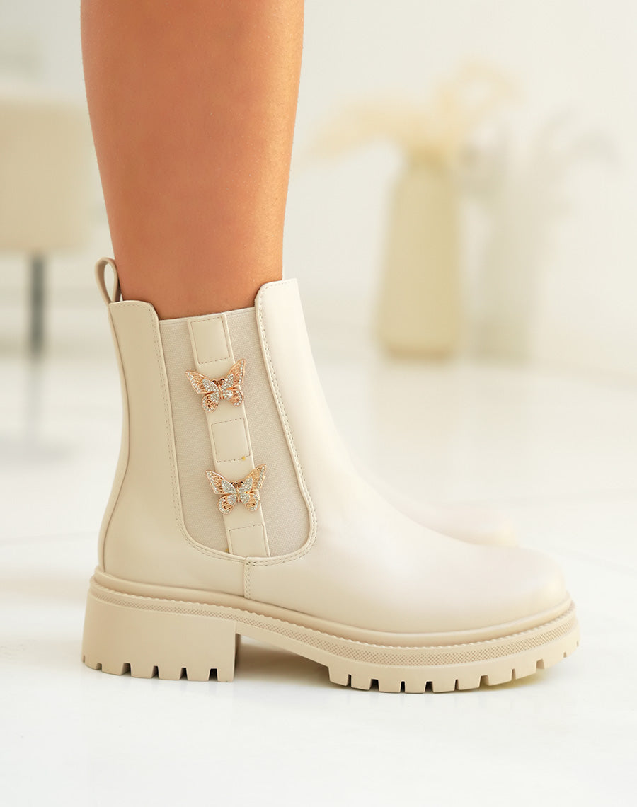 Bottines femme beige style Chelsea avec papillons dorés et semelle crantée