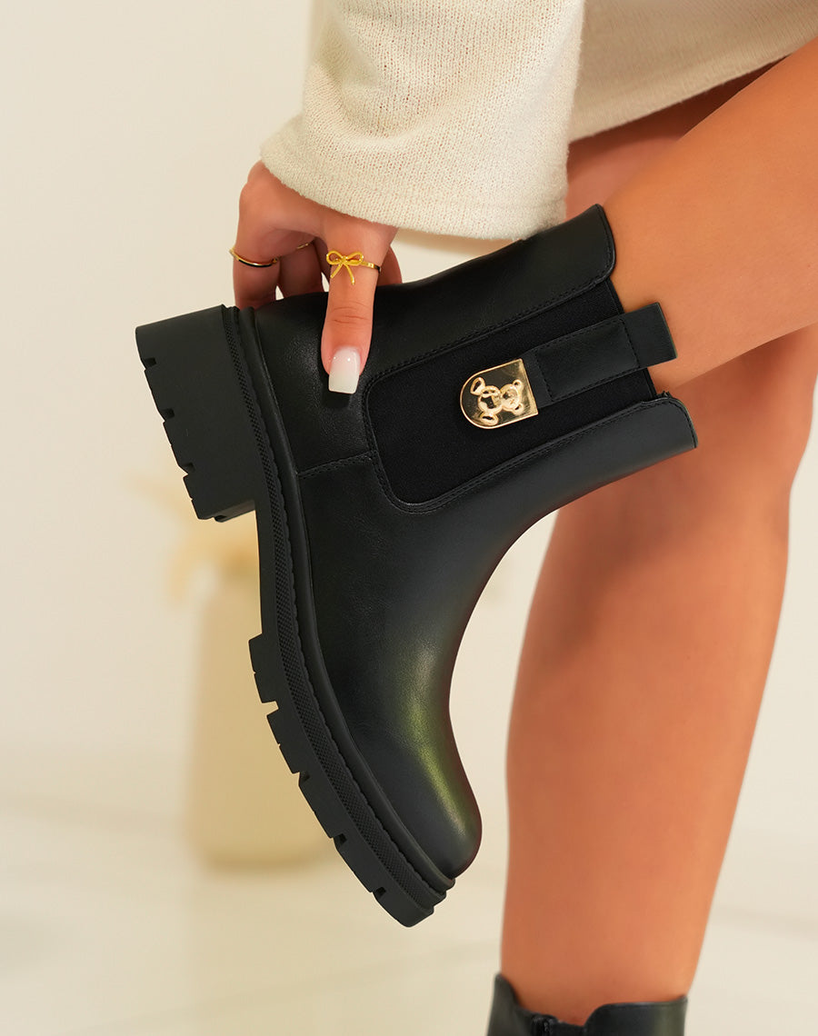 Bottines femme noires avec détail ourson doré et semelle crantée
