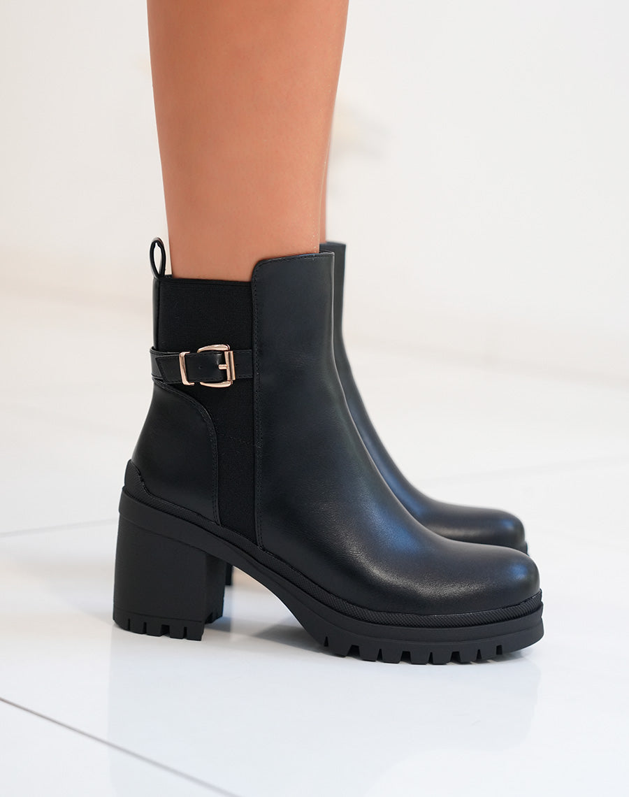 Bottines femme noires à talon avec lanière dorée et semelle crantée