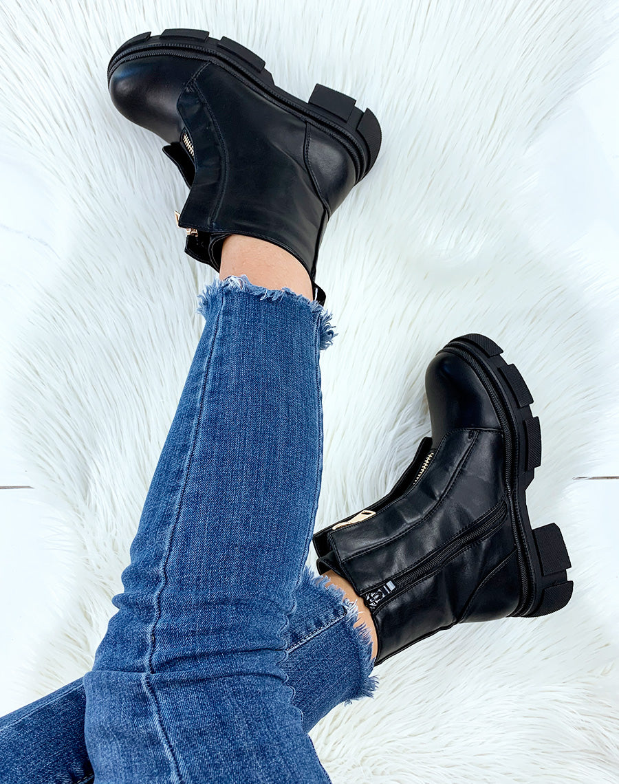 Bottines hautes noires à détail dorés