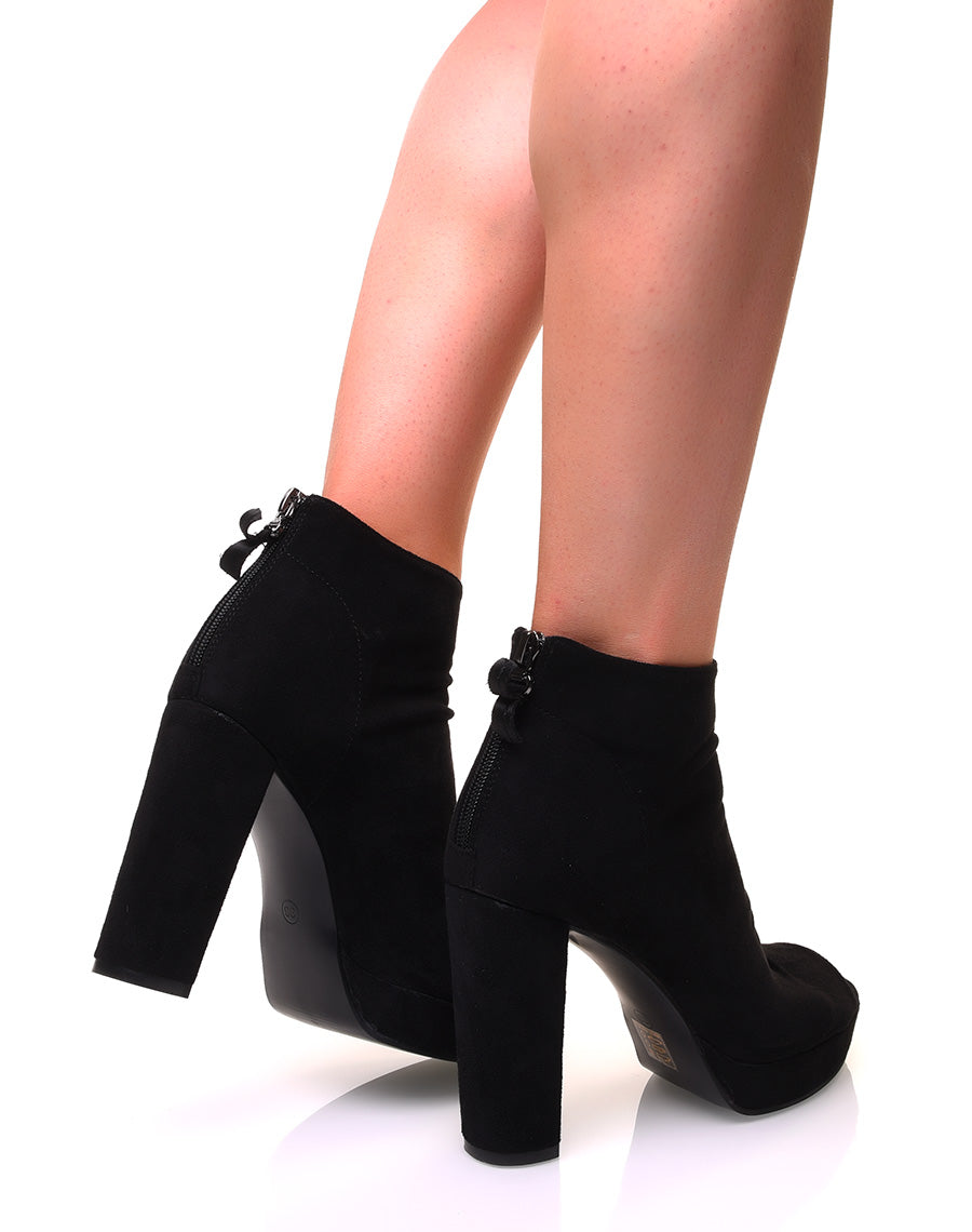 Bottines noires ajourées en suédine à talons carrés