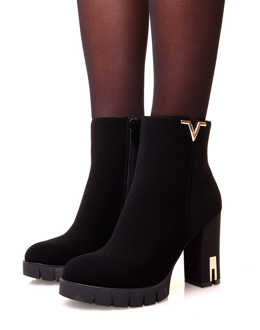 Bottines noires à talons en suédine à détails dorés