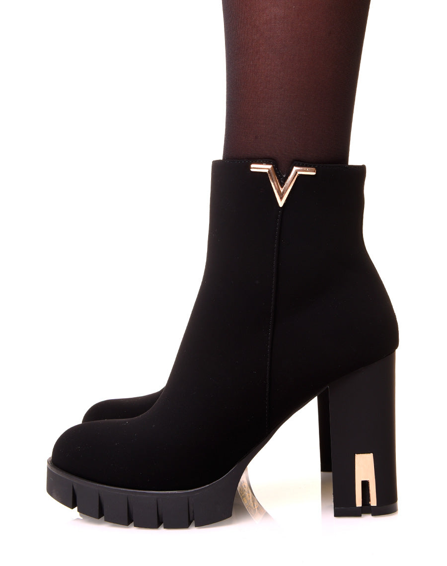 Bottines noires à talons en suédine à détails dorés