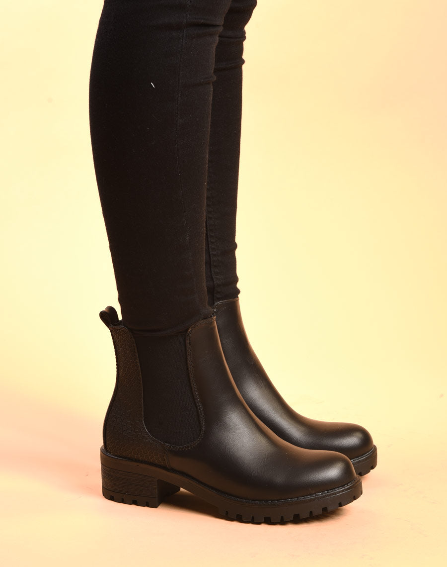 Bottines plates noires avec élastiques et motifs python