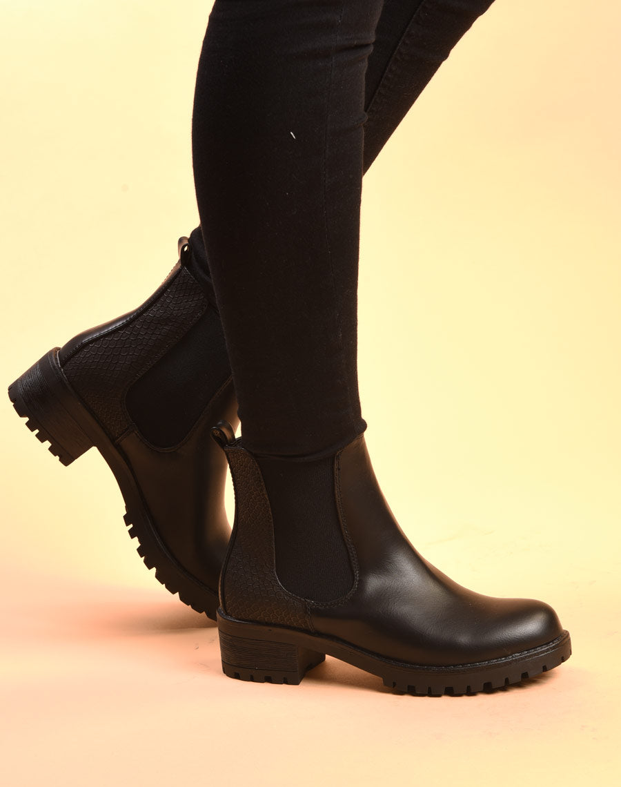 Bottines plates noires avec élastiques et motifs python
