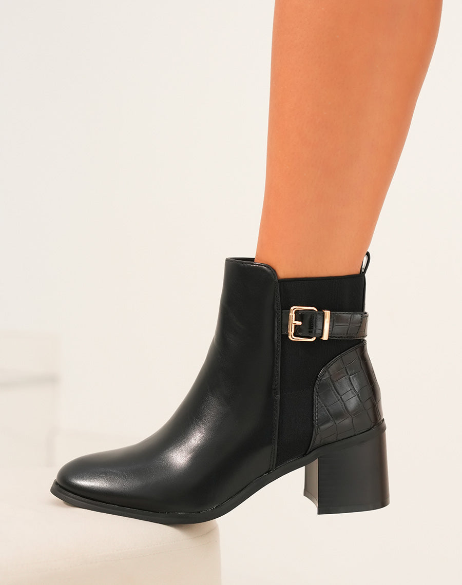 Bottines à talon noires bi-matières à sangle dorée