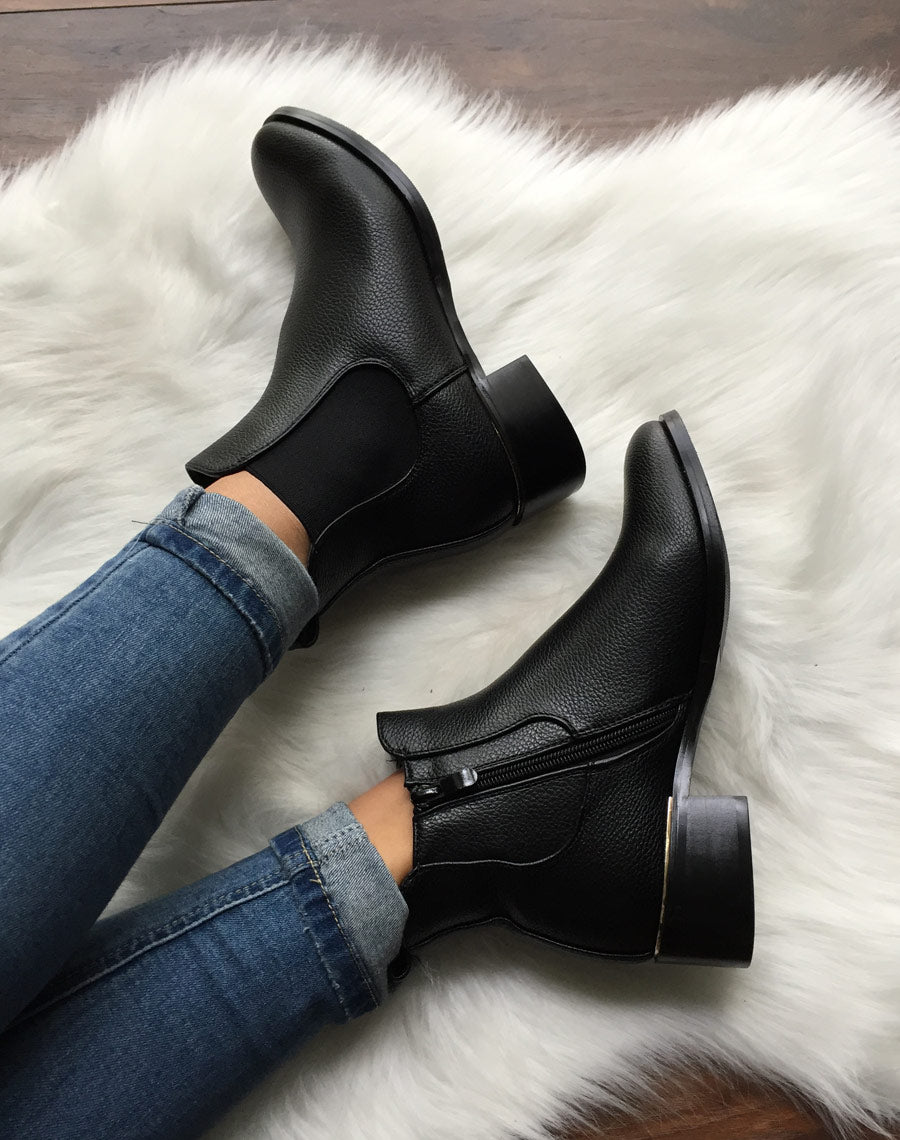 Chelsea boots noires à liseré doré