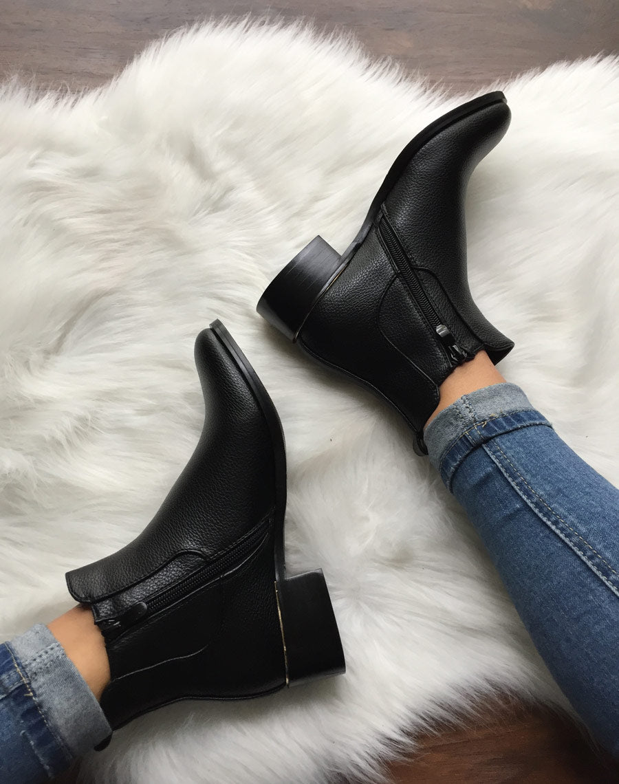 Chelsea boots noires à liseré doré
