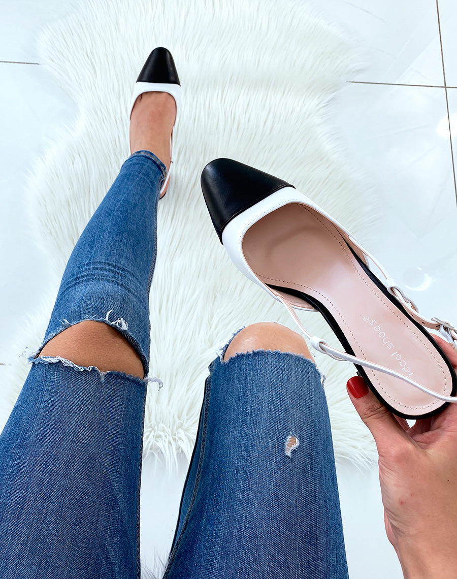 Escarpins noirs et blancs à bout rond et à petit talon