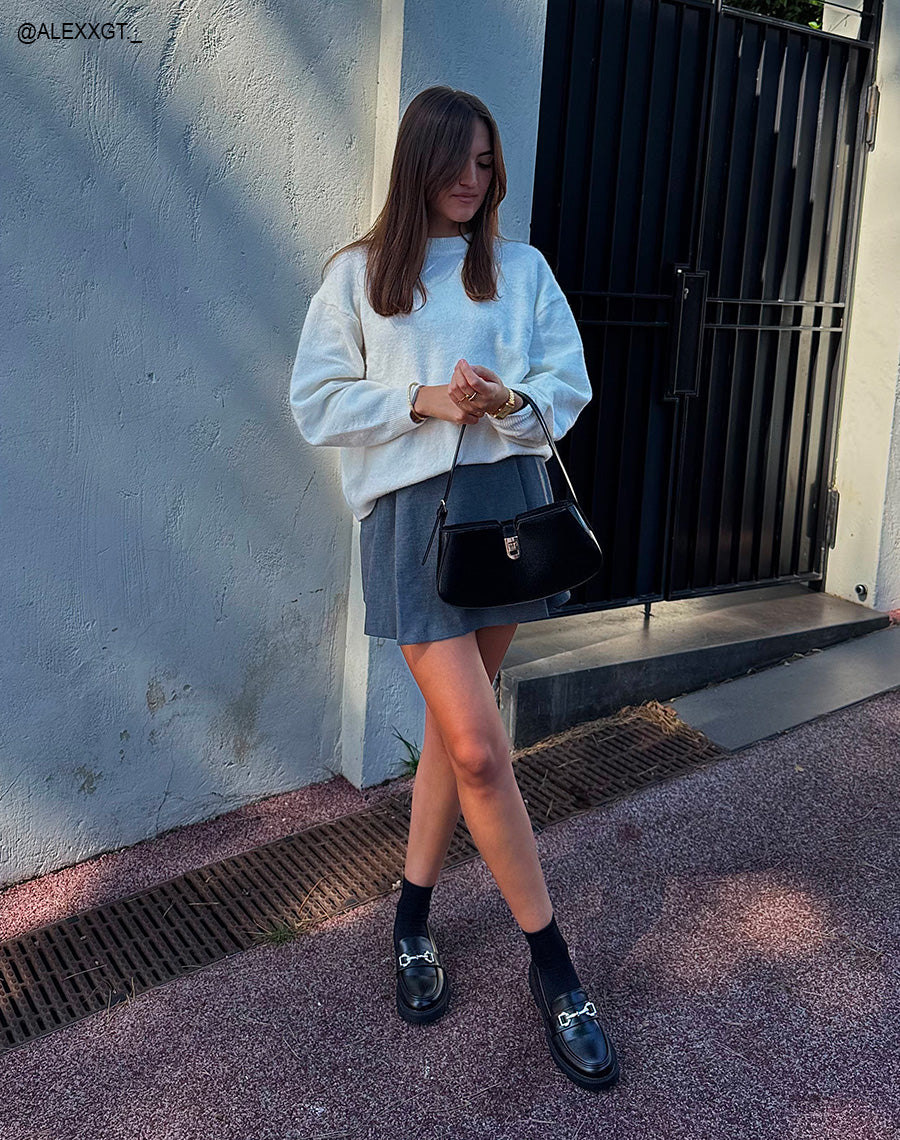 Mocassin femme noir avec semelle crantée et boucle argentée