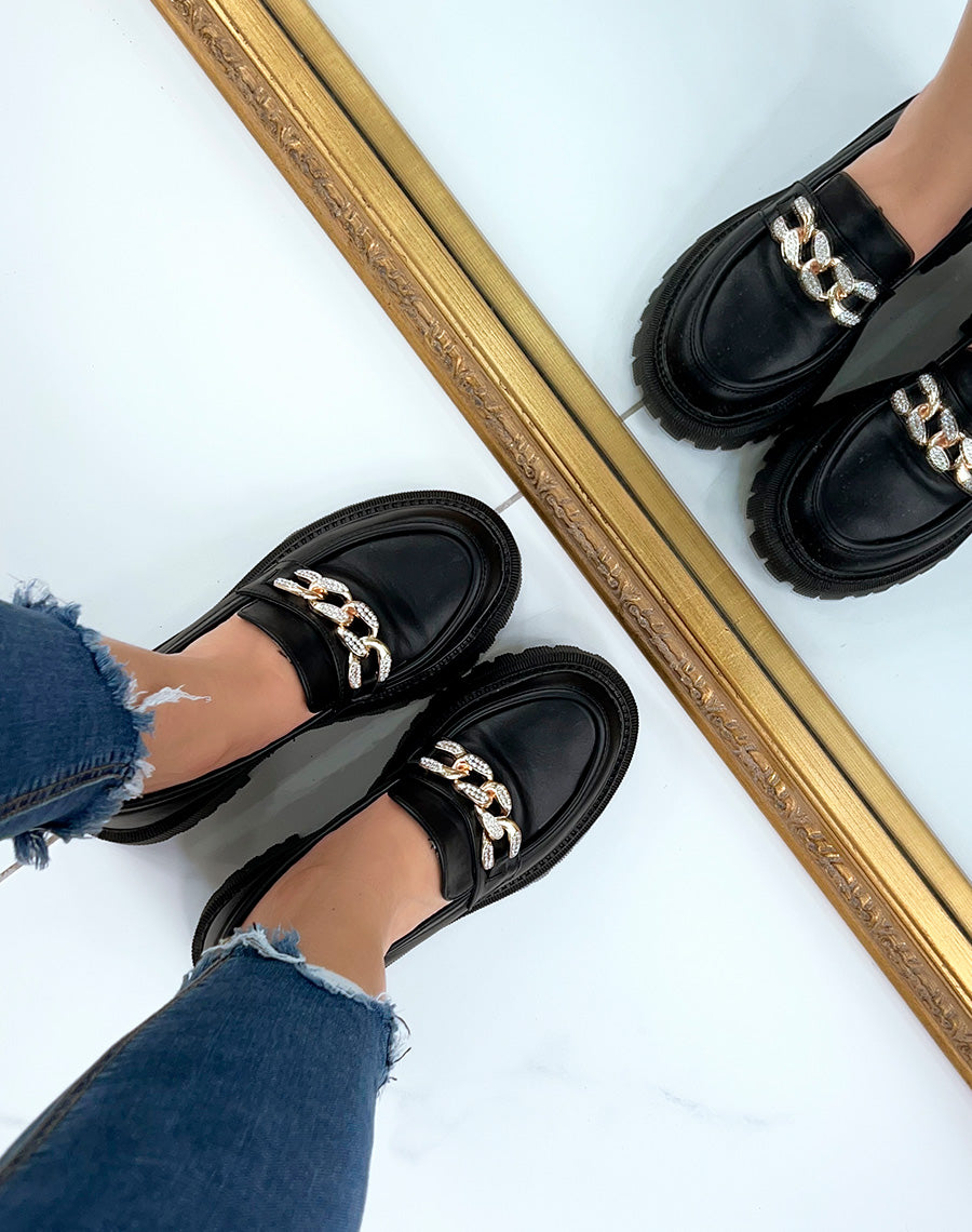 Mocassins noirs à chaîne dorée à strass et semelle crantée