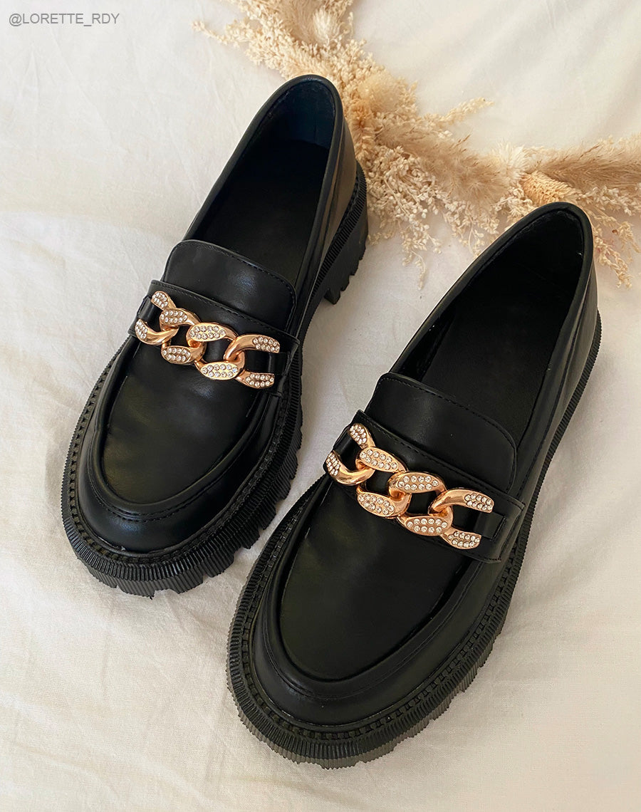 Mocassins noirs à chaîne dorée à strass et semelle crantée
