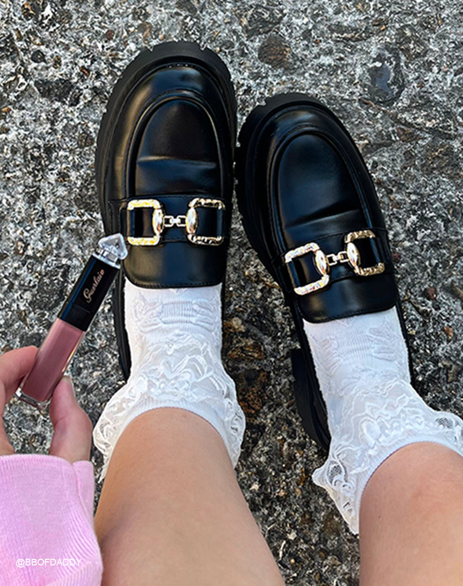 Mocassins noirs à plateforme pour femme avec détail doré