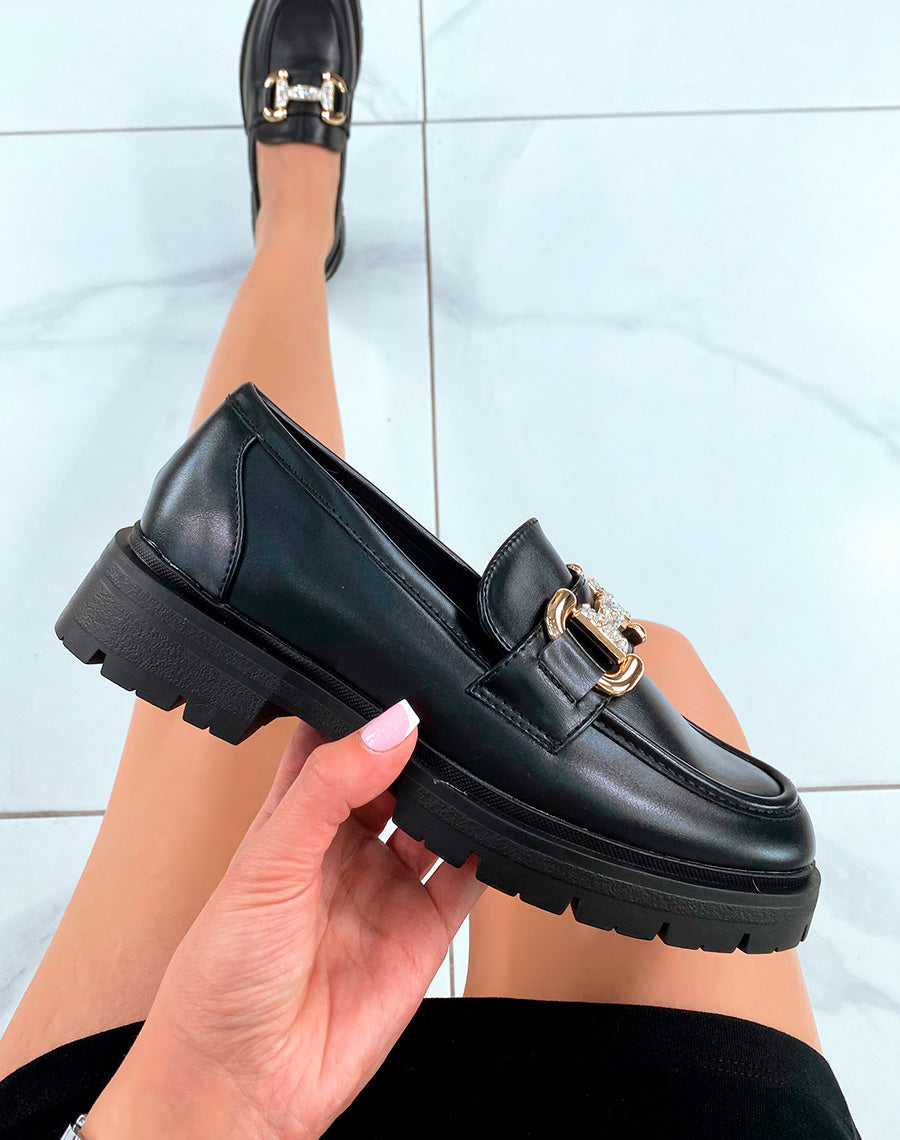 Mocassins noirs tendance pour femme avec détails dorés et strass