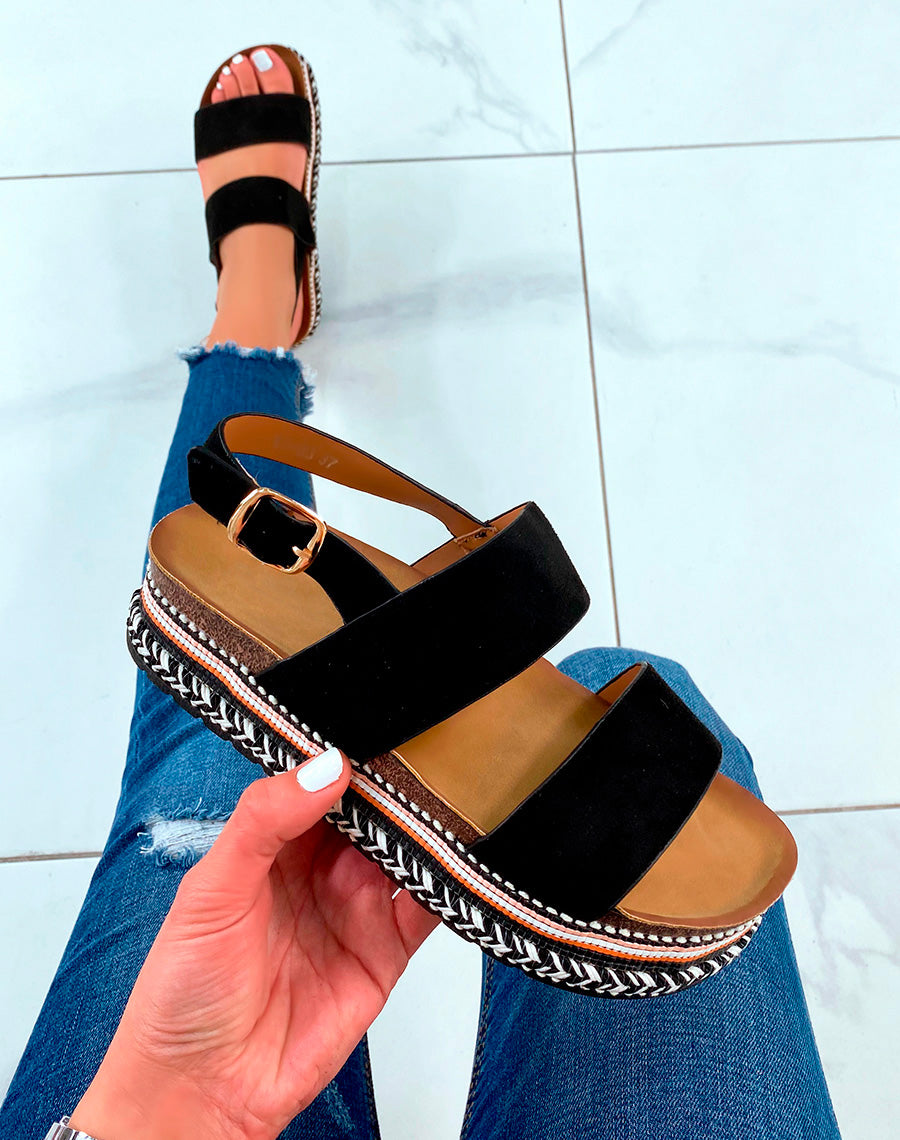 Mules en suédine noire à lanières entrecroisées et détails aztèque