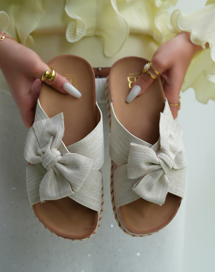 Mules femmes beiges avec n?ud et d?tails azt?ques sur plateforme ?paisse