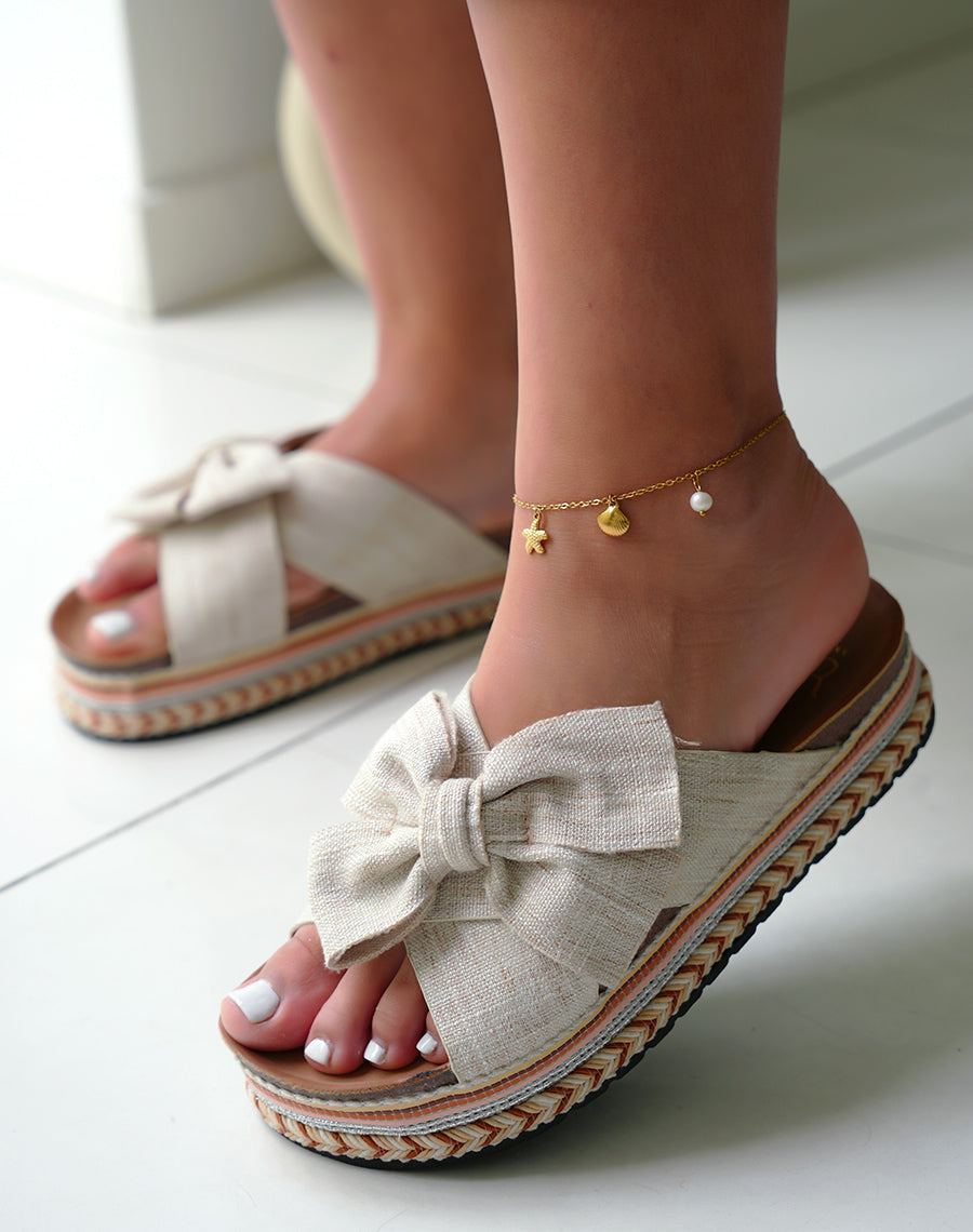 Mules femmes beiges avec n?ud et d?tails azt?ques sur plateforme ?paisse