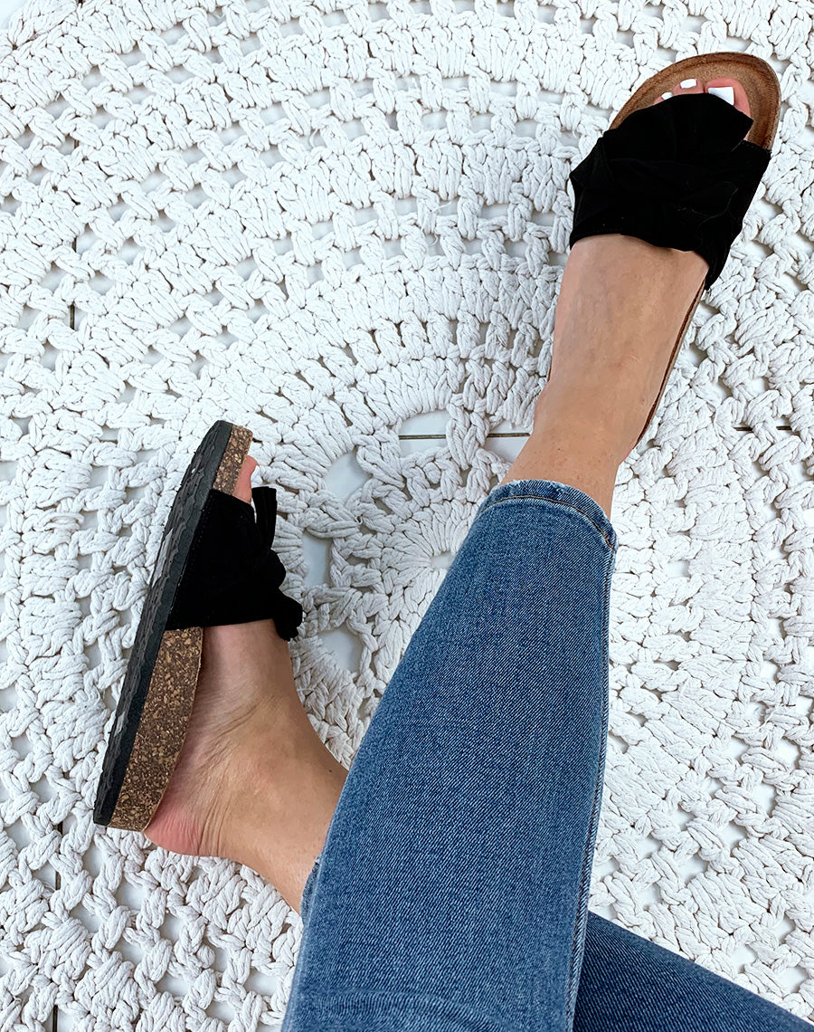 Mules noires en suédine à gros nœud volant