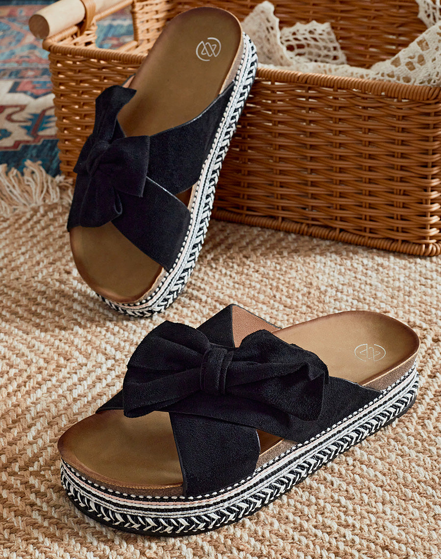 Mules à plateforme en suédine noire à gros noeud
