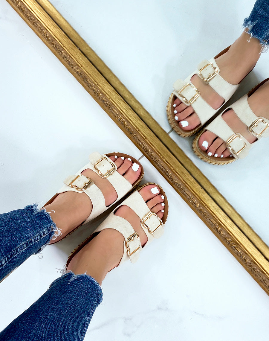 Mules plates beiges à double bride et semelle aztèque