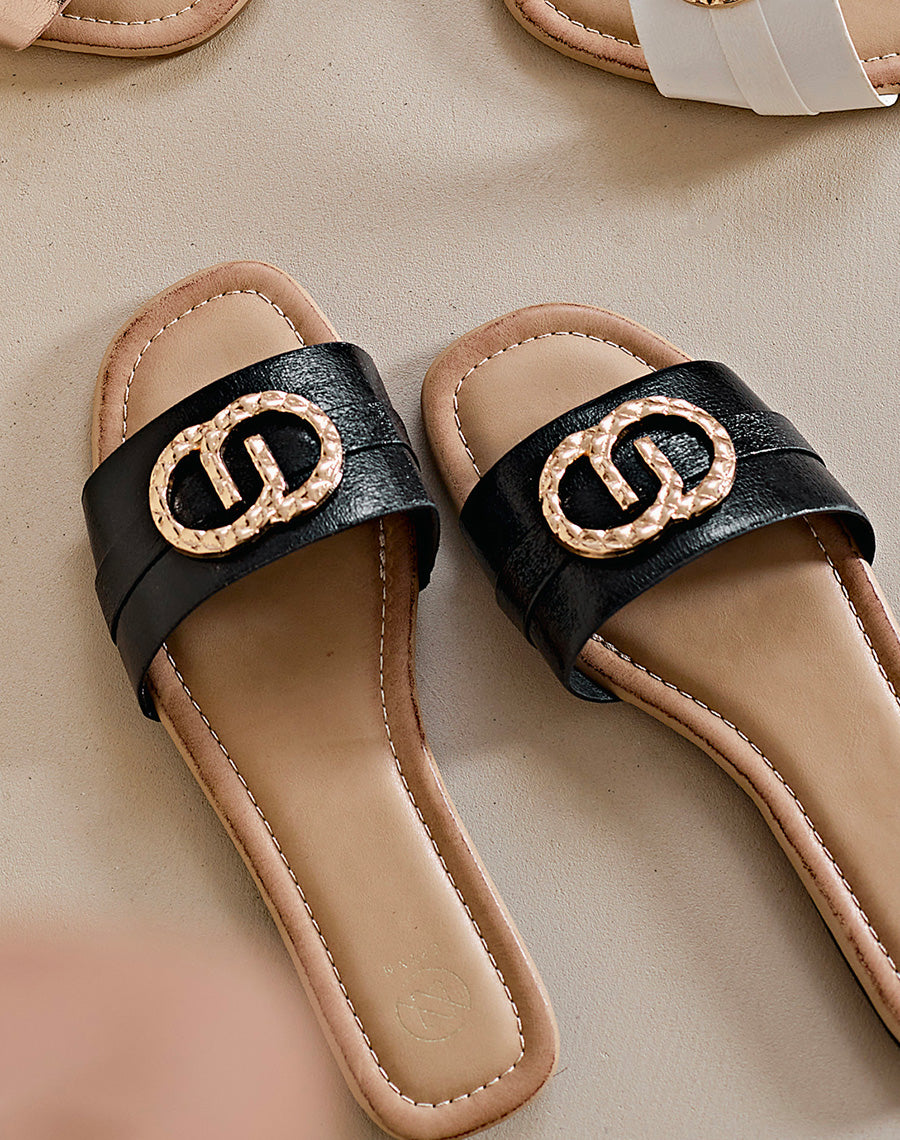 Mules plates noires à double boucle dorée
