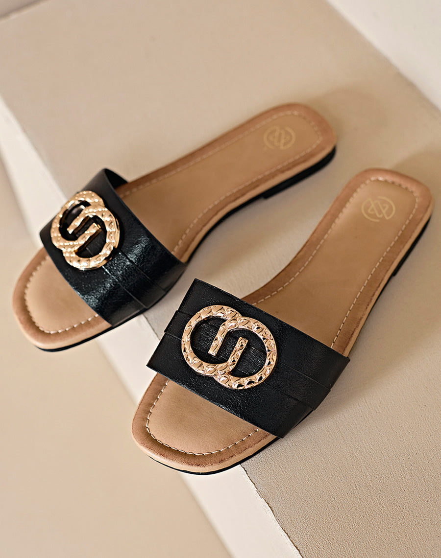 Mules plates noires à double boucle dorée